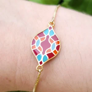 Bracelet réglable, avec intercalaire ovale, de couleur rouge, bleu, orange et doré, rappelant les azulejos portugais.