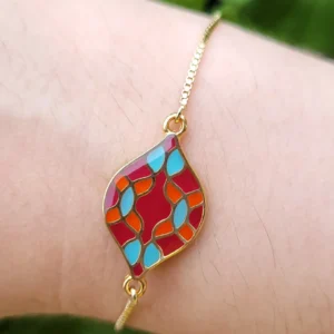 Bracelet réglable, avec intercalaire ovale, de couleur rouge, bleu, orange et doré, rappelant les azulejos portugais.